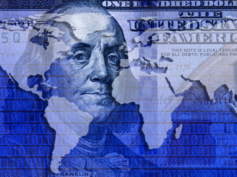 Close-up of Benjamin Franklin's face on a U.S. hundred-dollar bill overlaid with a world map and binary code.