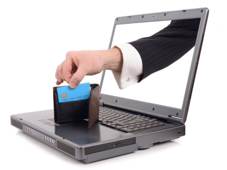 A hand in a business suit reaches from a laptop screen holding a wallet with a blue credit card.