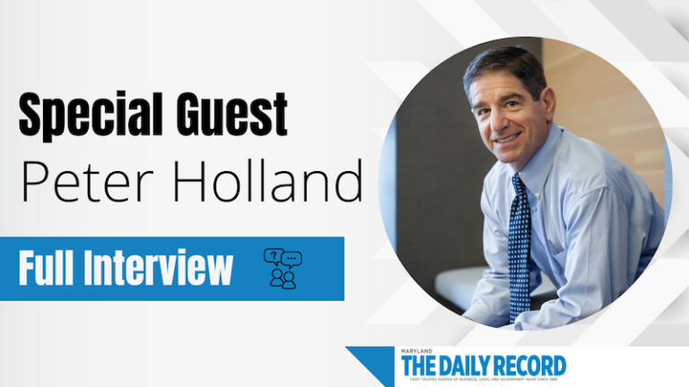 Professional headshot of a man in a blue shirt and tie, with text announcing special guest Peter Holland and full interview.