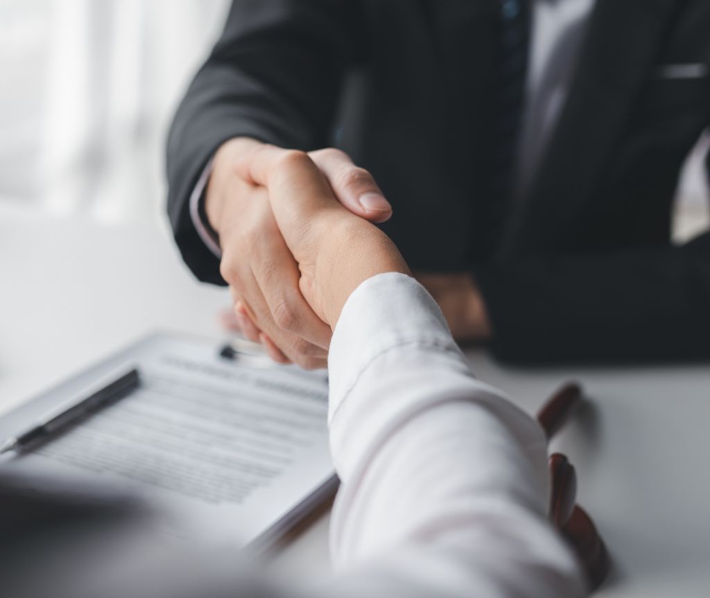 shaking hands business meeting