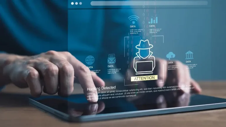 Close-up of hands interacting with a tablet displaying digital hacking detection and data icons.